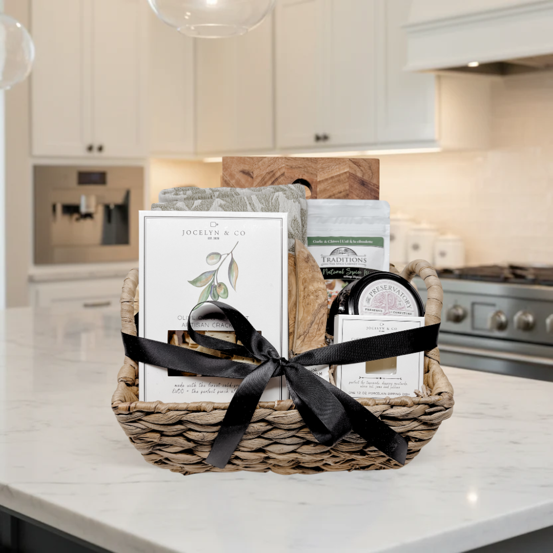 Gift basket with a black ribbon on a kitchen counter
