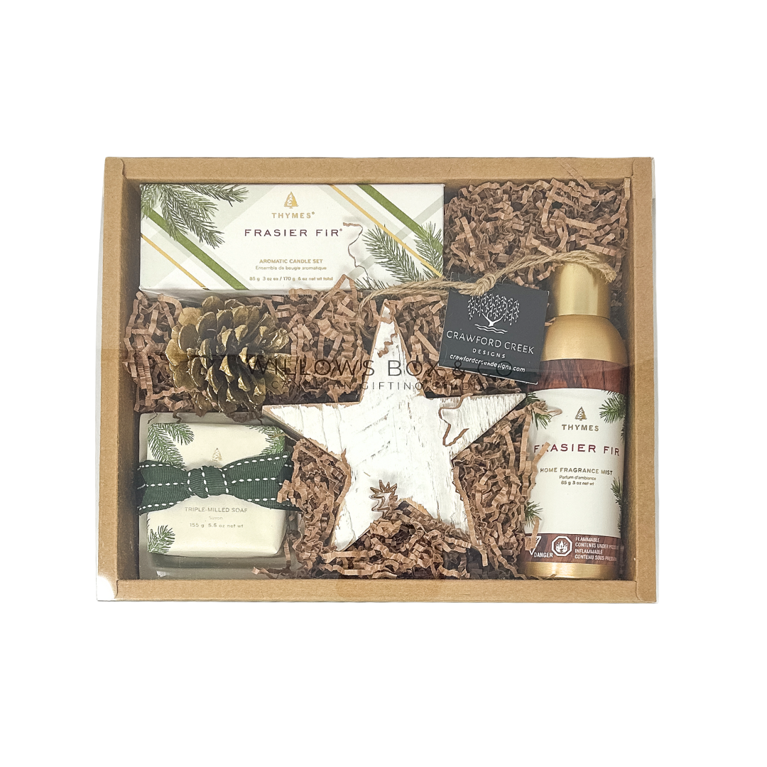 Gift set with a bottle of Frasier Fir candles, soap and roomspray, a box of tissues, and decorative elements in a kraft box.