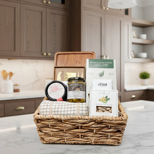 Gift basket with candles, soap, and other items on a white background