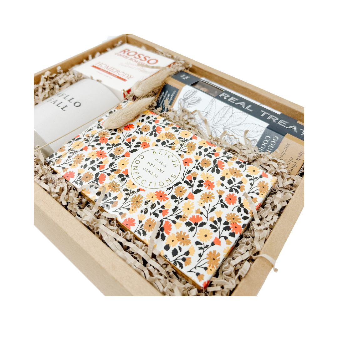 Gift basket with various items including a book titled 'Hello Fall' and a box of tissues, branded 'Rosso Coffee Roasters'.