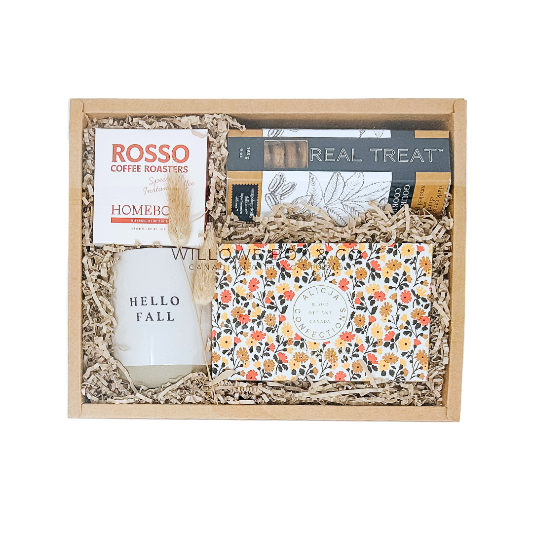 Gift basket with various items including a book titled 'Hello Fall' and a box of tissues, branded 'Rosso Coffee Roasters'.