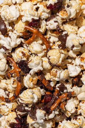 Close-up of popcorn mix with pretzels and chocolate pieces