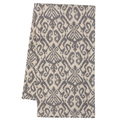 A folded rectangular textile, likely a throw blanket or scarf, featuring a gray and beige ikat damask pattern on a plain white background.