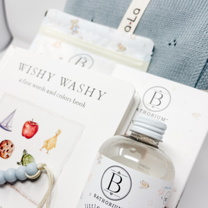 Bathorium bottle and Wishy Washy book on a light surface