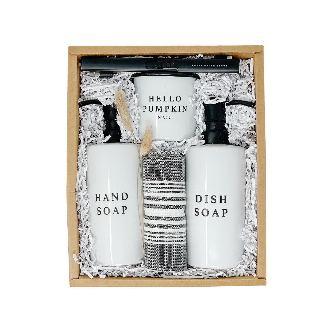 Set of hand soap, dish soap, and a towel in a decorative box with 'Hello Pumpkin' branding.