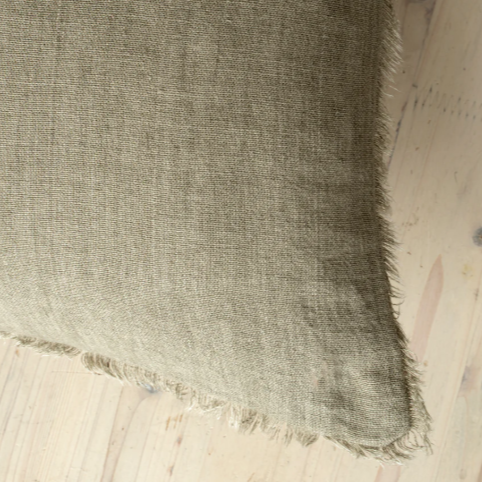 Textured fabric square on a wooden surface