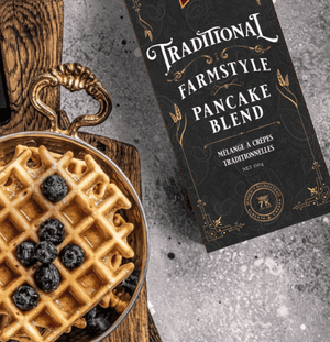 Traditional Farmstyle Pancake Blend packaging with a waffle and blueberries on a rustic background