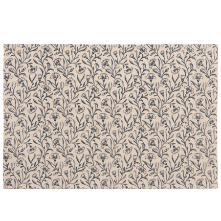 A rectangular area rug with a dense, repeating botanical pattern of small flowers and leaves in dark blue-gray on a warm beige background.