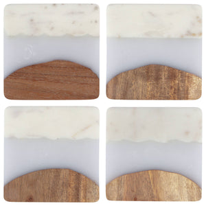 Four marble coasters with wooden holders on a white background
