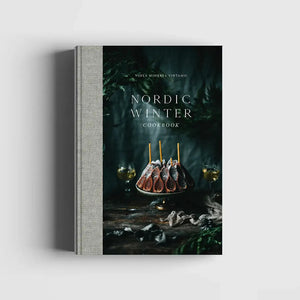 Cookbook titled 'Nordic Winter' with a cover featuring a dark scene with food and candles.