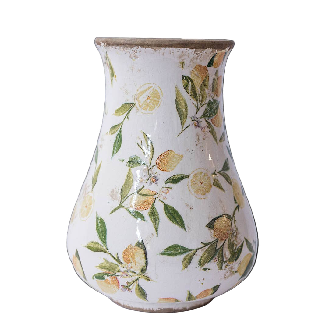 Ceramic vase with lemon and leaf pattern on a white background