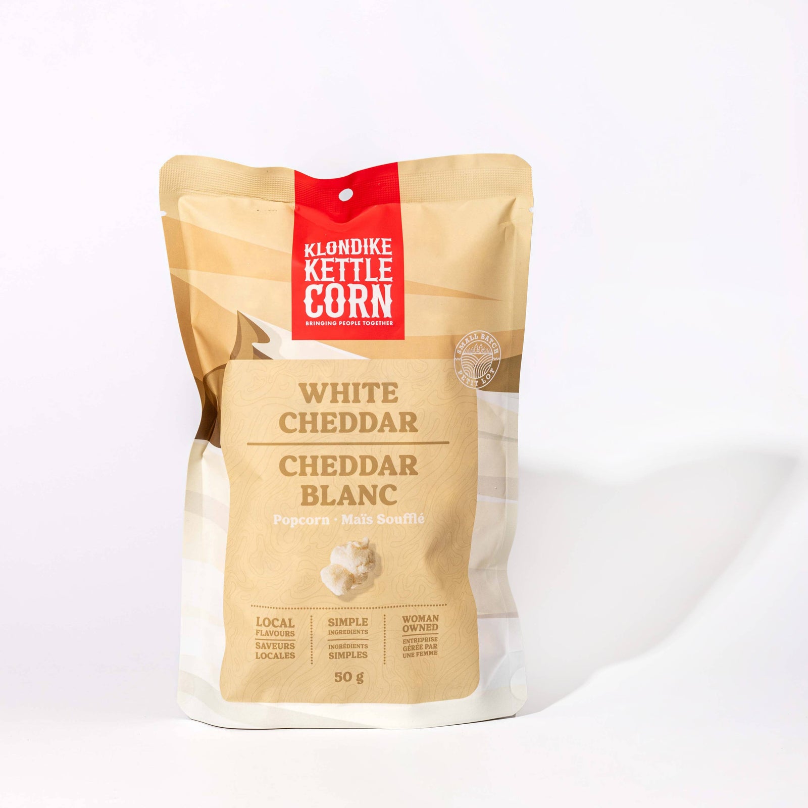 Kettle Corn packaging with 'White Cheddar' flavor on a white background