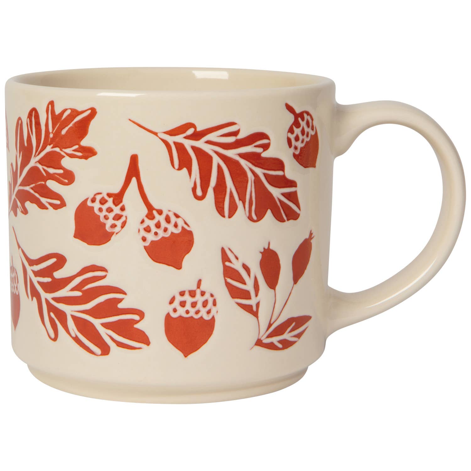 Three ceramic mugs with an orange and beige autumn leaf and acorn pattern, shown on a rustic wooden table with hot chocolate, marshmallows, and a cinnamon stick.